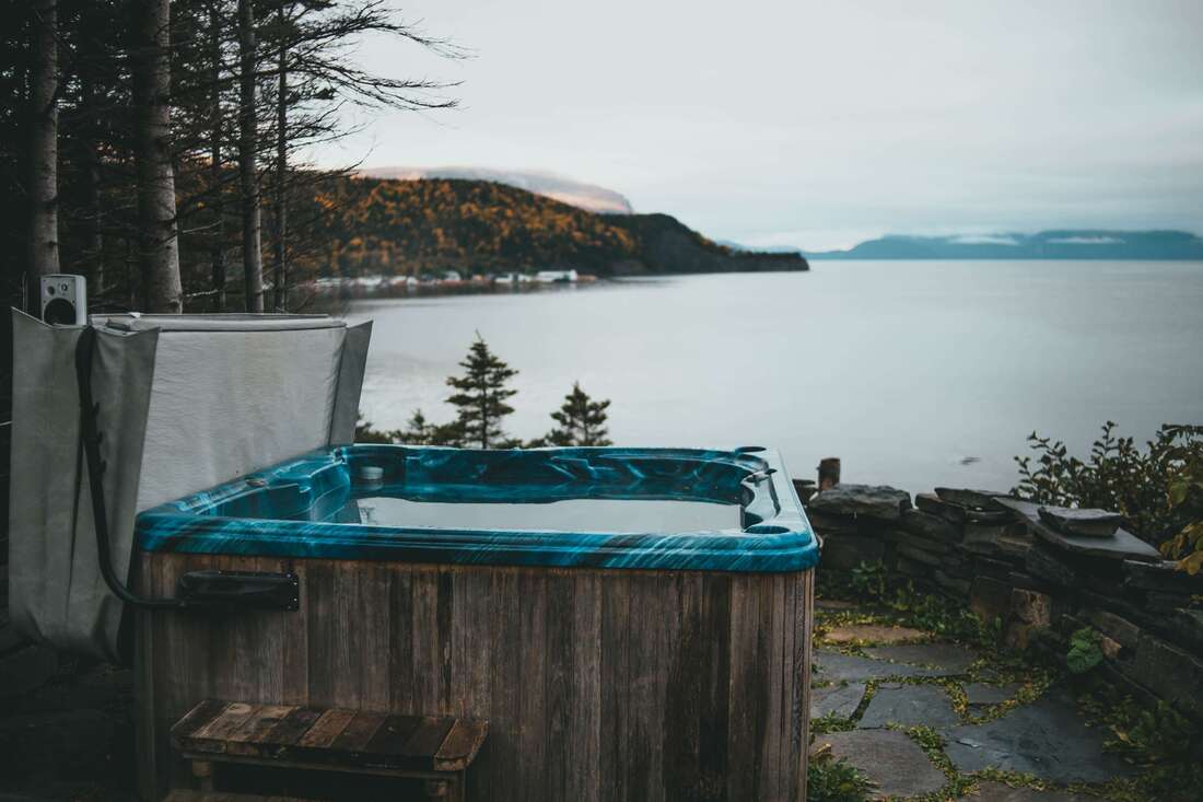 Broken Hot Tub with lake in background